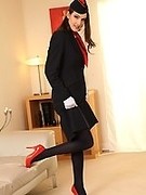 Sexy airhostess strips from her uniform down to sexy dark pantyhose and red high heels  (Petra V)